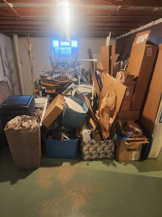 Roll-off dumpster container at job site for 8 Yard Dumpster Rental in Oscoda